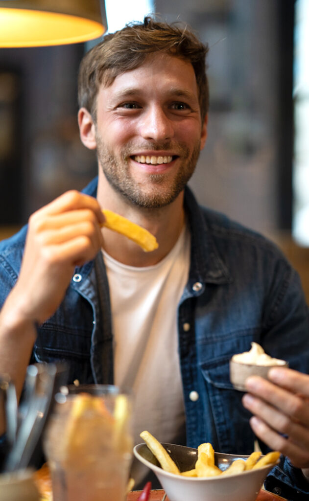 man eating fries